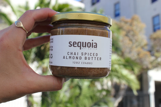 Our natural chai spiced almond butter is crafted with premium California-grown almonds and a warm blend of organic spices, including ceylon cinnamon, ginger, cardamom, cloves, and tellicherry black pepper. Sweetened with organic date sugar and infused with pure vanilla, this creamy spread delivers a rich, aromatic flavor with a hint of warmth and a touch of celtic sea salt. Perfect for toast, apple slices, oatmeal, smoothies, and more. No added oils or refined sugars—just pure, spiced goodness.
